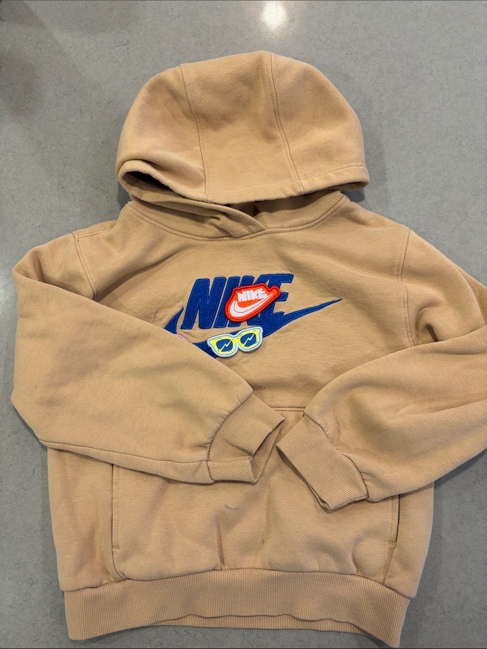 Nike Kids Beige Hoodie with Blue Swoosh and Multicolor Patches
